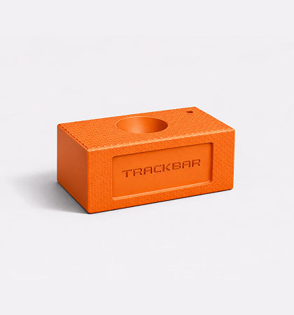 Orange rectangular block with circular hole and "TRACKBAR" text embossed on front face