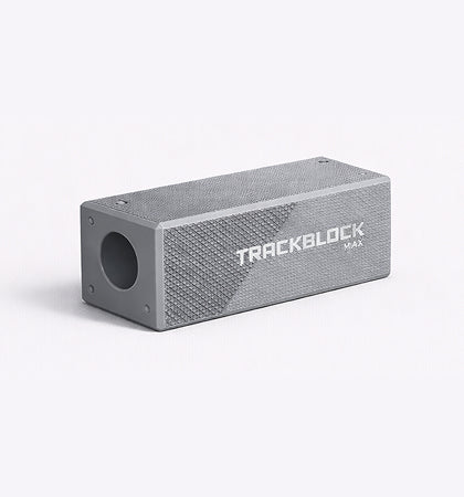 Gray rectangular TrackBlock device with textured surface and circular opening on one end